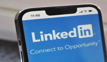 Phone with LinkedIn on screen