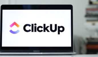 Laptop with ClickUp logo on the screen