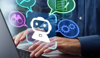 Individual typing on computer using chatbot graphic