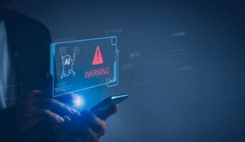 A mobile phone showing a projection of AI scam warning.