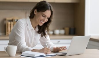 Woman sat at desk with laptop