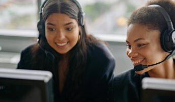 Two contact center agents at work