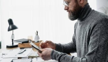 Guy fills out payroll paperwork