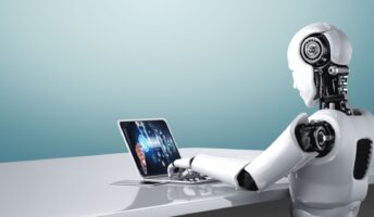 Robot Working on Laptop