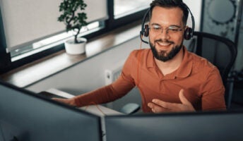 Person on headset working at desk