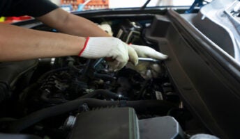 Mechanic working on vehicle
