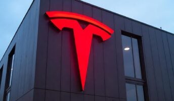 Tesla logo in red on building