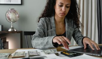 A woman does accounting with software